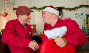 Chip and Bernie shake hands as they learn to work together as a team during a Christmas adventure at the North Pole.